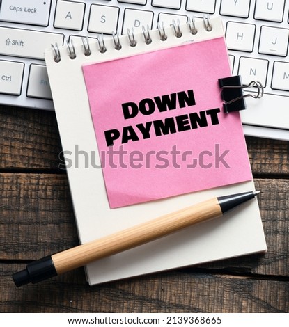 DOWN PAYMENT words on a small piece of paper.