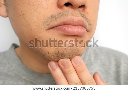 Japanese men have dirty mouths with beards. Royalty-Free Stock Photo #2139385753