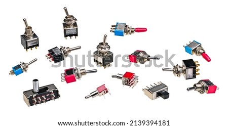 Different types of electrical toggle switches isolated on a white background. Collection of miniature electromechanical electronic components with metal on-off lever for use on printed circuit boards. Royalty-Free Stock Photo #2139394181