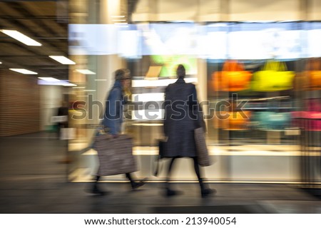 Intentional Blurred Image of Young People in Shopping Center 