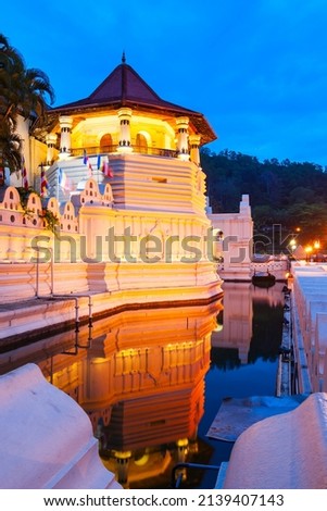Temple of the Sacred Tooth Relic or Sri Dalada Maligawa in Kandy at sunset. Sacred Tooth Relic Temple is a Buddhist temple located in the royal palace complex of the Kingdom of Kandy. Royalty-Free Stock Photo #2139407143
