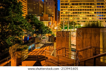 Stairs and buildings at night at the Inner Harbor in Baltimore, Maryland.