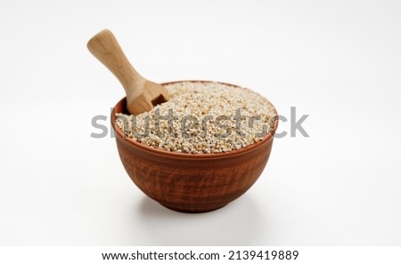 Barley groats in bowls and bags isolated on a white background. High quality photo Royalty-Free Stock Photo #2139419889