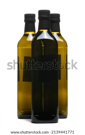 Olive oil in glass bottle isolated on white