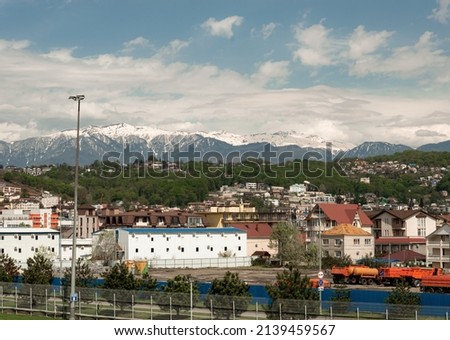 city against backdrop of mountains. sunset Sochi, sunset in mountains, sky with clouds black sea. nature of Russia