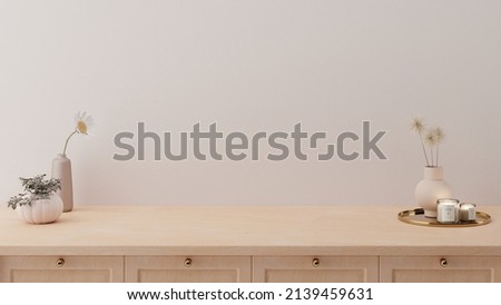 Minimal cozy counter mockup design for product presentation background. Branding in Japan style with bright wood counter and warm white wall with vase plant flower candle. Kitchen interior. 