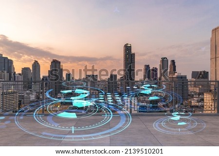 Rooftop with concrete terrace, Bangkok sunset skyline. Hi tech digital holograms to optimize business process by applying new technologies. City downtown. Double exposure.