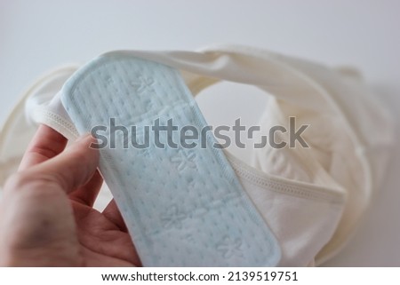 Using Sanitary pads with white women underwear panties in white background.

