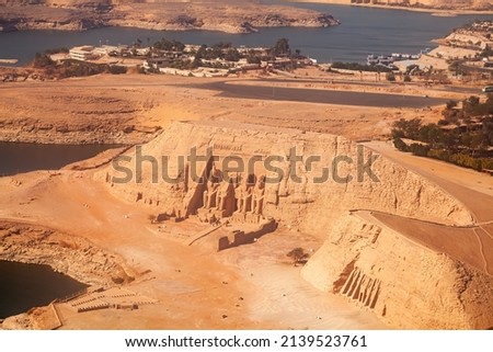 Aerial view of The Great Temple of The Pharaoh Rameses II and The Small Temple of Hathor and The Queen Nefertari in the village of Abu Simbel, Aswan, Upper Egypt. Royalty-Free Stock Photo #2139523761