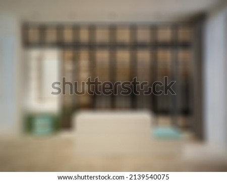 defocused and blur photo of luxury and modern walk in closet interior design