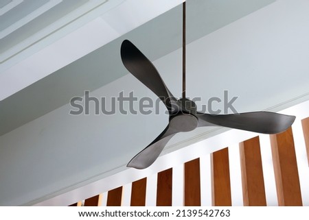 electric ceiling fan, modern style Royalty-Free Stock Photo #2139542763