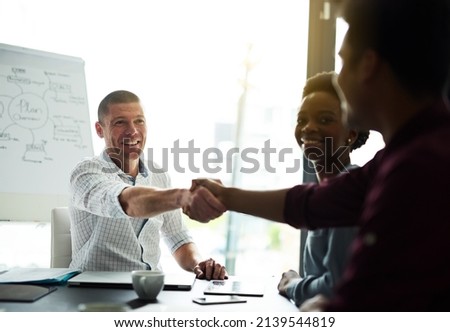 Our skills together will make for a winning combination. Cropped shot of businesspeople shaking hands during a meeting in an office.