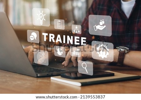 Person working on computer with icons of Trainee program and apprenticeship On the Job Training Learning. Royalty-Free Stock Photo #2139553837