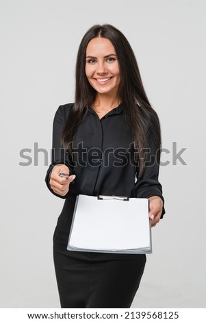 Signing contract document. Business deal. CV. Auditor inspector examiner controller writing on clipboard, checking the quality of goods and service looking at camera isolated in white background Royalty-Free Stock Photo #2139568125