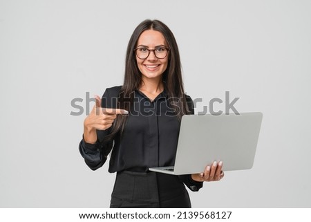 Caucasian young confident businesswoman ceo manager bank employee worker boss having idea startup pointing at laptop for remote work, watching webinars online, multitasking isolated in white Royalty-Free Stock Photo #2139568127