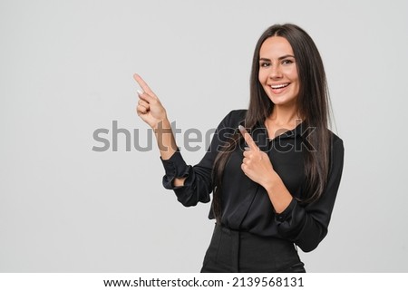 Confident caucasian young businesswoman freelancer CEO boss manager bank employee in formal wear looking at camera pointing at free copy space isolated in white background