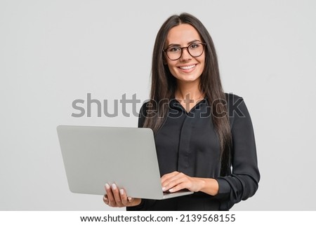 Smiling caucasian young businesswoman bank employee worker manager boss ceo looking at camera, using laptop for distant education work, e-learning, watching webinars online isolated in white Royalty-Free Stock Photo #2139568155