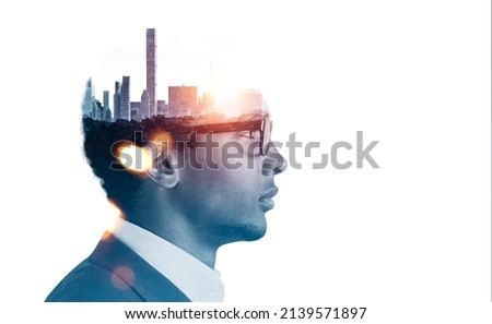 African American businessman wearing formal suit and glasses. New York city skyscraper panoramic view instead of man brain. White background. Concept of imagination, inspiration and megapolis Royalty-Free Stock Photo #2139571897
