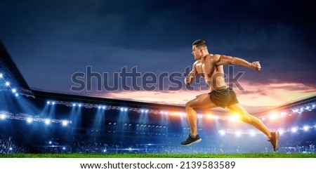 Male runner against stadium . Mixed media