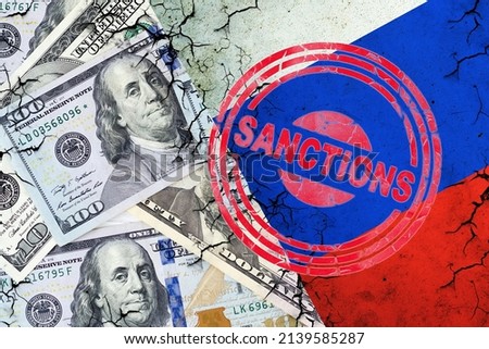 Dollar bills, and a cracked Russian flag. Sanction stamp. The concept of sanctions against Russia. Finance. Business.