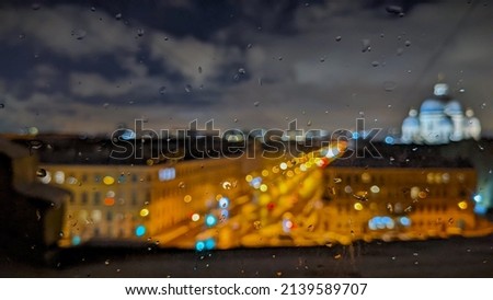 Night St. Petersburg. It is raining outside the window, but the stunning night view of the city lights gives pleasure and warmth.