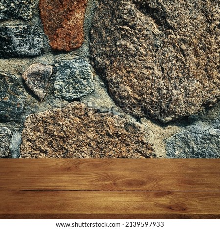 The background is blank wooden boards and a textured stone wall with lighting and vignetting.
