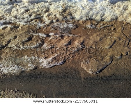 dirty and melted snow in early spring in Russia
