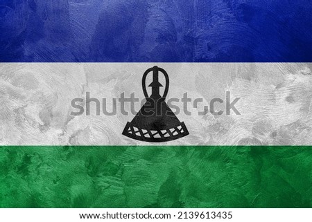 Textured photo of the flag of Lesotho.