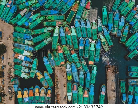 drone shot aerial view top angle bright sunny day seascape boats coastal town Harbour  turquoise blue water waves ocean beach beautiful wallpaper background 