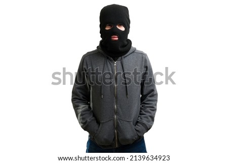 Studio shot of a masked unrecognizable young man wearing a black balaclava  Royalty-Free Stock Photo #2139634923