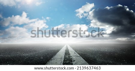 Road background. Close up view from asphalt level. Empty asphalt road and blue sky with white clouds. Road markings. Panorama Royalty-Free Stock Photo #2139637463