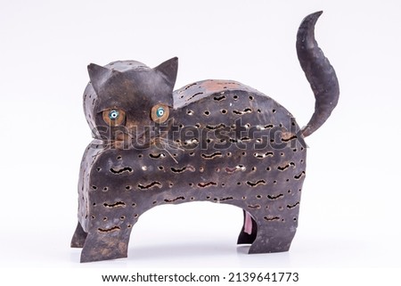 abstract pastel background image made of decorative candle holder object in cat shape composition on white background buying. 