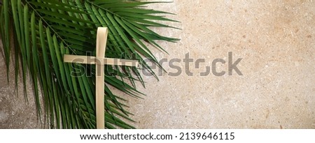 Palm cross and palm leaves. Palm sunday and easter day concept. Royalty-Free Stock Photo #2139646115