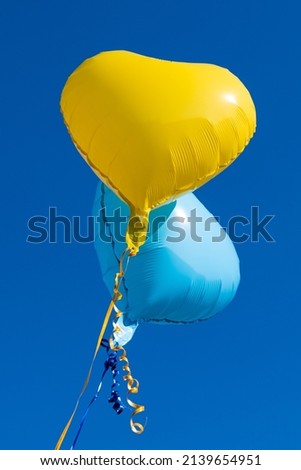 Ukrainian air helium balloons against the blue sky 