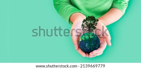 Hand hold plant on earth on isolated background for ecology environment concept. symbolic to tree. Elements of this image furnished by NASA (include path)