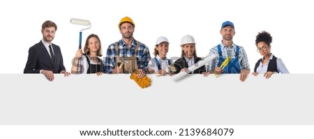 Portrait of happy construction workers holding blank billboard isolated on white background, empty copy spcae for text content