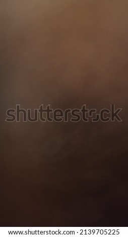 Abstract image and speed in white, orange, brown and red.
