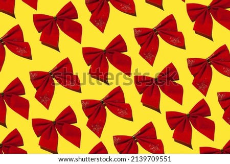 red bows on a yellow background. High quality photo