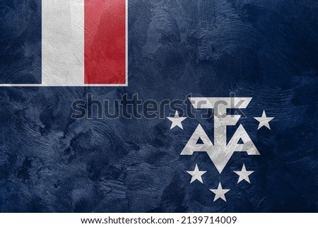 Textured photo of the flag of French Southern and Antarctic Lands.