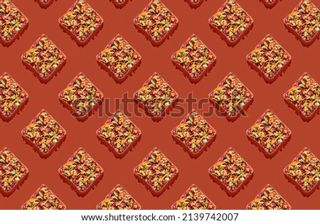 Pattern of sandwichs on red pastel background