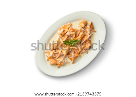 Fish and vegetables in a bowl. Food photography, light background