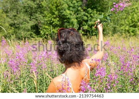 Young girl in a field where sage grows