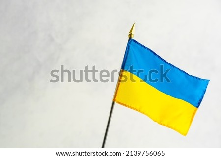 The state blue and yellow flag of Ukraine is a state in Eastern Europe. Symbol of patriotism, independence. A peaceful state suffering from Russian aggression.