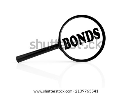 BONDS text on magnifier glass on white background