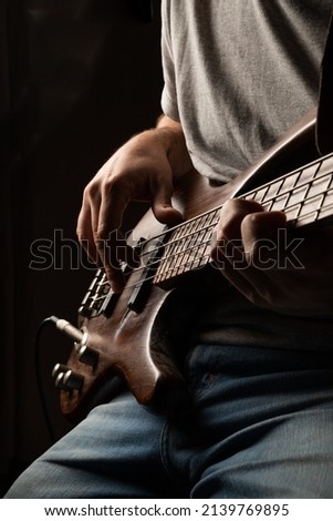 
playing the bass, bass and guitar lessons Royalty-Free Stock Photo #2139769895