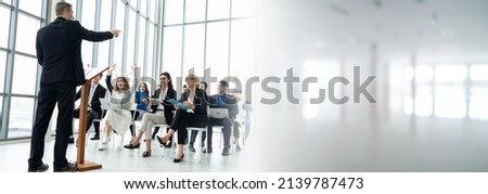 Group of business people meeting in a seminar conference widen view . Audience listening to instructor in employee education training session . Office worker community summit forum with speaker . Royalty-Free Stock Photo #2139787473