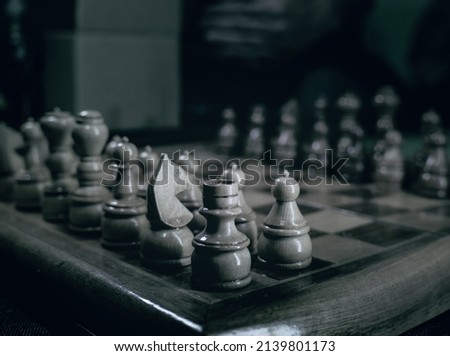 Kragujevac, Serbia.05.03.2021. Chess board with pieces in selective focus, dramatic lighting.
