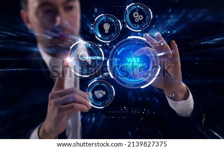 Business, Technology, Internet and network concept. Young businessman working on a virtual screen of the future and sees the inscription: Web hosting Royalty-Free Stock Photo #2139827375
