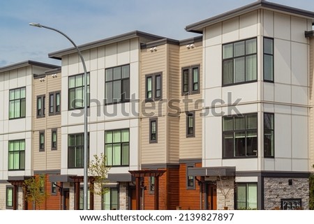 Brand new apartment building in BC, Canada. Canadian modern residential architecture. Nobody, street photo, exterior.