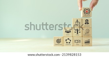 Core values,corporate values concept.  Company culture and strategy related to business and customer relationship, growth. Principles guide company's action. Stack wooden cubes with core values icons. Royalty-Free Stock Photo #2139828153